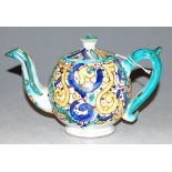 A 19th century Japanese porcelain bullet shaped teapot and cover, decorated in the satsuma palette