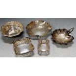 A white metal embossed bonbon dish, stamped Silver; a Mappin & Webb shell shaped bonbon dish; and