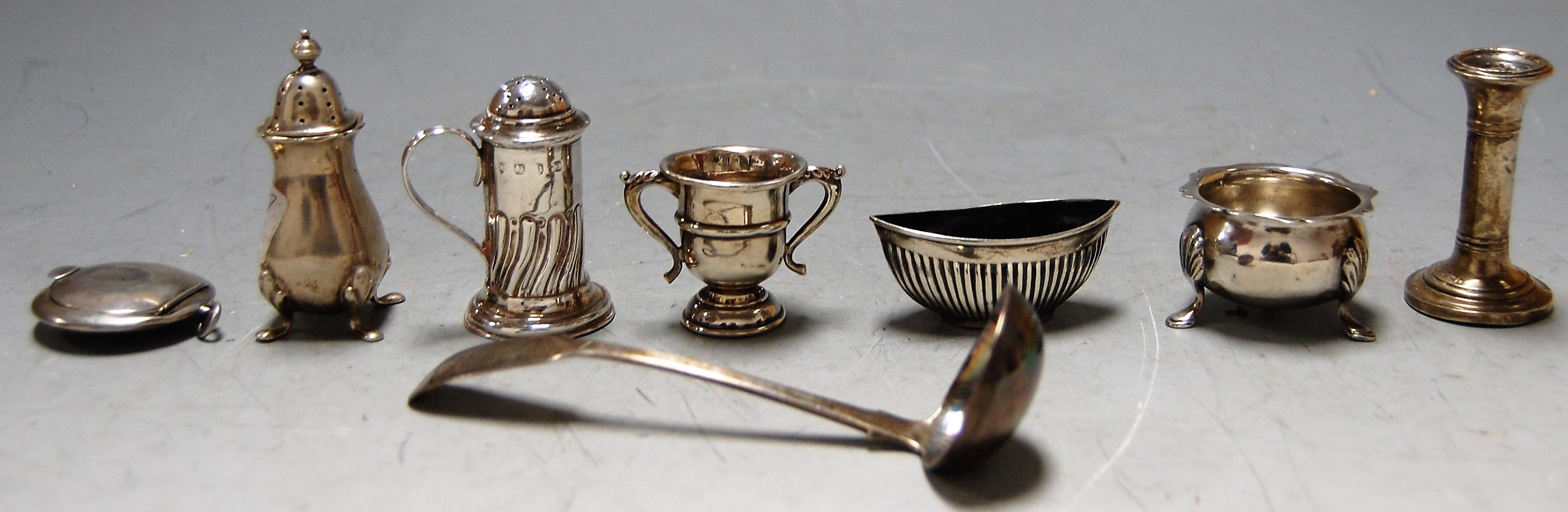 A small collection of assorted silver wares to include Georgian style open salt, small Scottish