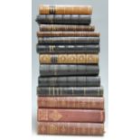 A small collection of leather bound volumes, to include The First Men in the Moon by H.G. Wells, the