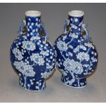 A pair of Chinese export blue and white moon flasks, each with four character marks verso, h.25cm