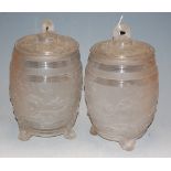 A pair of heavy moulded and frosted glass wine barrels and covers, h.33cm