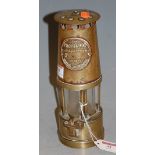 A brass miners safety lamp by the Protector Lamp and Light Co Ltd makers of Eccles, Manchester;