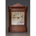 A mid-20th century stained beechwood cased mantel clock, with spring driven movement, 22cm