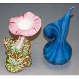 A soft paste porcelain cornucopia vase; together with a contemporary blown glass vase (2)