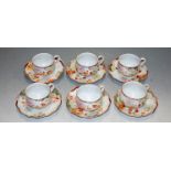 A set of six Japanese eggshell teacups and saucers