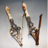 A pair of chrome beer pumps, each ceramic handle depicting a hunting scene