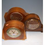 An Art Deco walnut veneered chiming and striking mantel clock by Smiths; and two others (3)