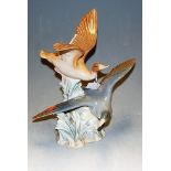A Lladro porcelain duck group, incised number 28, h.29cm