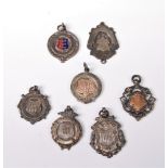 A silver football medallion, Birmingham 1949, together with four other silver medallions and two