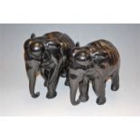 A pair of African carved ebony elephants