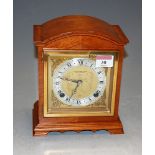 An Elliot walnut cased mantel clock, having twin barrel going striking movement, retailed by Thurlow