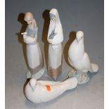 Four various Nao porcelain figures, to include nesting dove