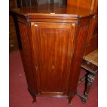 A circa 1900 mahogany, satinwood inlaid and further chequer strung single door corner cupboard,