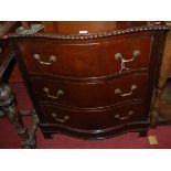 A mahogany serpentine front chest of three long drawers, having gadrooned edge, w.70cm