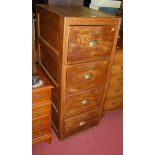 An early 20th century oak four drawer office filing chest, having panelled sides, w.52cm