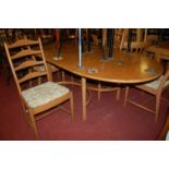 A contemporary Ercol light elm dining suite comprising D-end dining table having a pull-out action