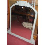 A Victorian and later painted arch topped overmantel mirror, having floral crested surmount, 128 x