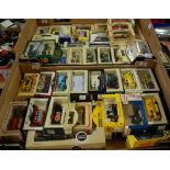 Two trays containing a quantity of boxed modern issue diecast to include Days Gone Lledo
