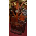 A Victorian mahogany hall-tree, having mirror inset