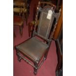 A pair of early 20th century oak barley twist dining chairs each having cane inset backs