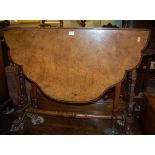 A mid-Victorian walnut and figured walnut shaped top Sutherland table