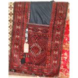 A Persian red ground woollen saddle-bag