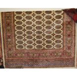 A modern Persian cream ground Bokhara carpet, 190x140cm