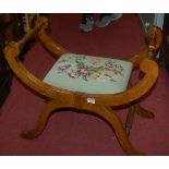 An early 20th century walnut and oak floral tapestry topped X-framed dressing stool