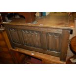 A moulded oak linenfold three panelled hinge-top blanket box, w.92cm