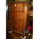 A reproduction mahogany serpentine front chest of four long drawers; together with a similar five