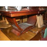 A reproduction mahogany extending dining table having pull out action, two extra drop-in leaves, max