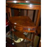 An early 19th century mahogany bowfront corner washstand