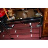 A pair of contemporary mirrored chests, each of three long drawers, by John Lewis (one with