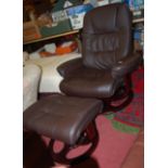 A contemporary brown leather upholstered swivel armchair with matching footstool (2)