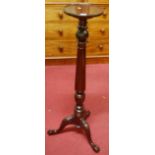 A contemporary mahogany turned and fluted pedestal plant stand, having a circular dished top, h.