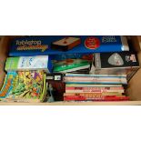A modern beech effect toy chest containing a quantity of annuals, table top games etc, examples to