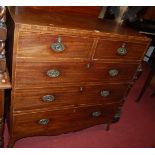 An early 19th century mahogany and satinwood strung chest, of two short over three long drawers, w.