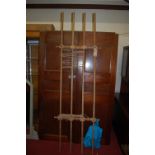 An early 20th century turned pine laundry airing rack, length 232cm