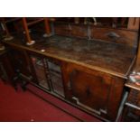 An early 20th century geometric moulded oak ledgeback sideboard, w.153cm