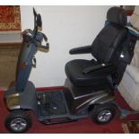 A T.G.A. battery powered mobility scooter, with two keys, charger and further accessories (vendor