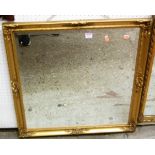 A gilt framed bevelled square wall mirror