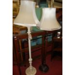 A white painted and floral decorated fluted standard lamp; together with one other similar
