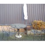 A contemporary granite topped circular garden table raised on iron base, dia. 100cm; together with a