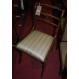 A pair of 19th century mahogany rail back dining chairs, each having striped upholstered drop-in pad