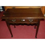 A late 18th century stained walnut single drawer side table, having a wavy cut frieze, w.90cm