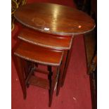 An early 20th century walnut oval nest of three occasional tables; together with an Edwardian