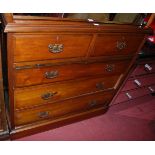 An Edwardian walnut squarefront chest of two short over three long drawers, w.106cm