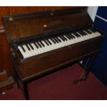 A Dulcitone oak cased travelling piano by Thomas Machell & Sons, Glasgow, Scotland, width 97cm