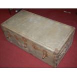 An early 20th century canvas clad and metal bound travelling trunk, w.101cm